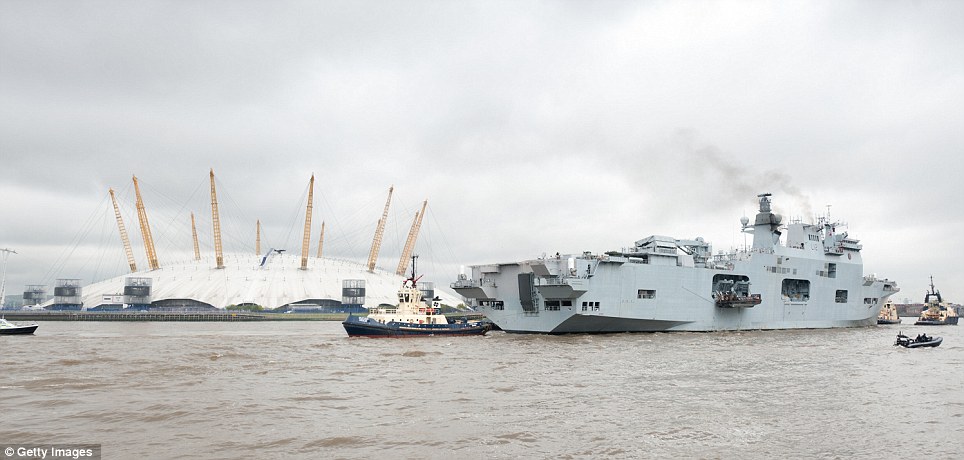 The Carrier HMS Ocean makes her way up the River Thames as part of security rehearsals ahead of the London Olympics