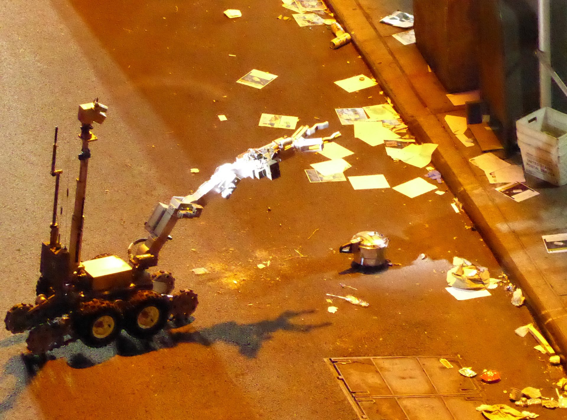  A police robot handles the unexploded pressure cooker bomb in West 27th Street in New York. Photograph: Lucien Harriot/Getty Images